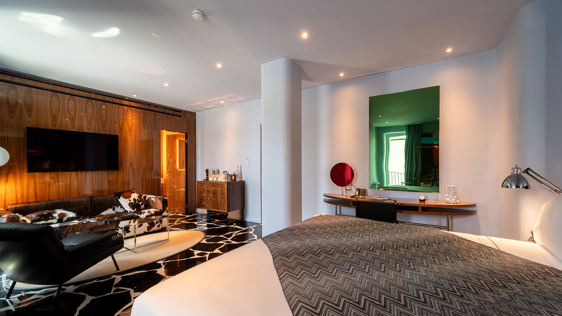 Double Room detail with bed and sofa Hotel Calimala Milan