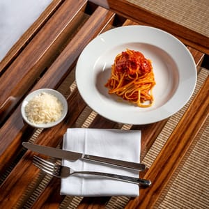 Plate of pasta by the pool
